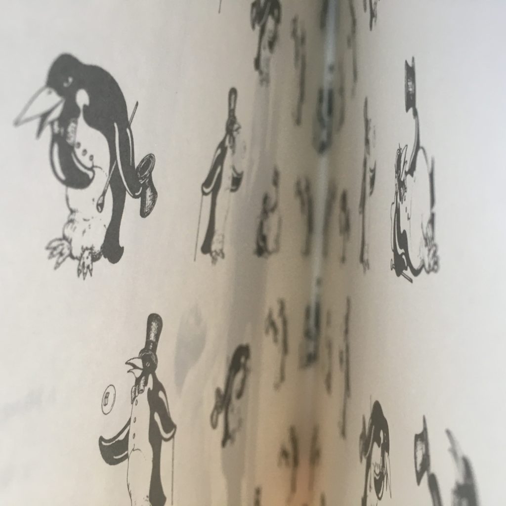 The inside of the cover contains penguins