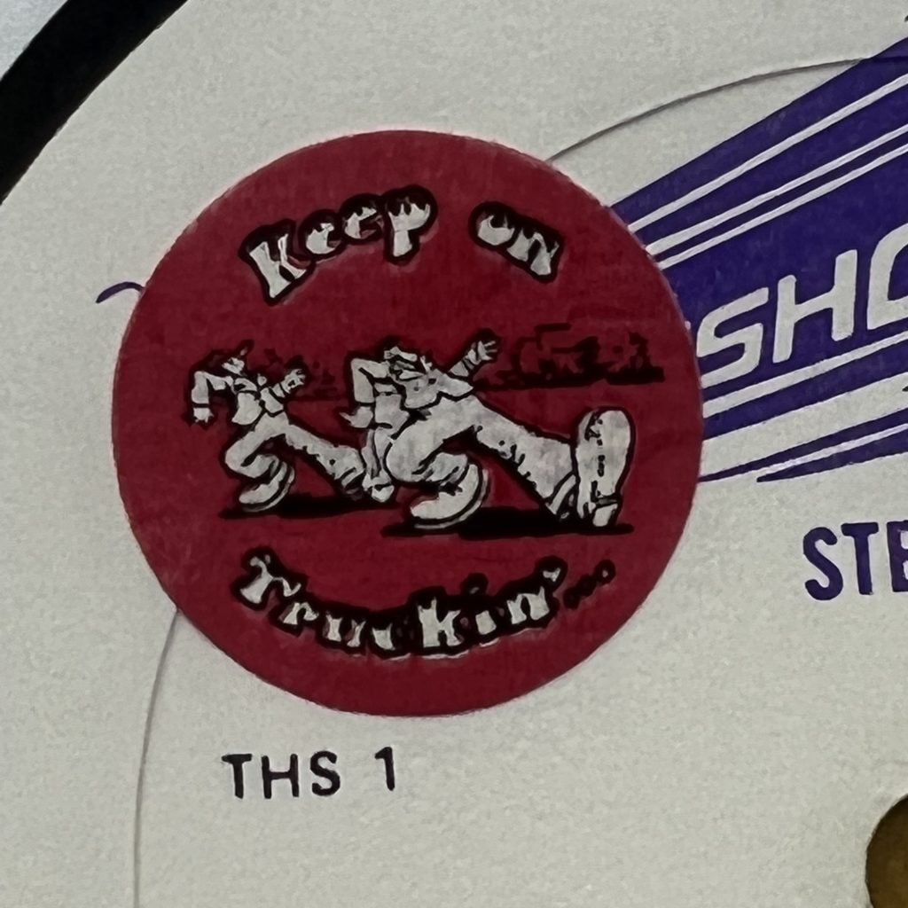 A previous owner emblazoned his records with R. Crumb "Keep on Truckin'" stickers as a sign of ownership, I'm guessing.