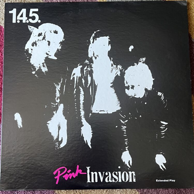 The front cover of 1.4.5.'s "Pink Invasion" Extended Play record. The high-contrast photograph was courtesy of my friend, the photographer who someone brought me on board to this project as a "designer." I painted the letters for "Pink" with a brush, and printed the "Invasion" from some lead type.