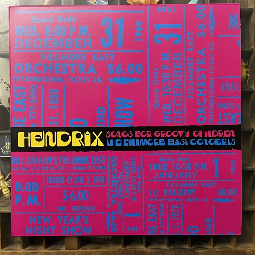 Jimi Hendrix Songs for Groovy Children front cover – the cover is made up entirely of type, with the background being numerous images of tickets from the Dec. 31, 1969 and Jan. 1, 1970 shows these recordings were taken from, and just a band across the middle with the title in a very stylized, psychedelic font that says 'Hendrix – Songs For Groovy Children - The FillMore East Concerts."