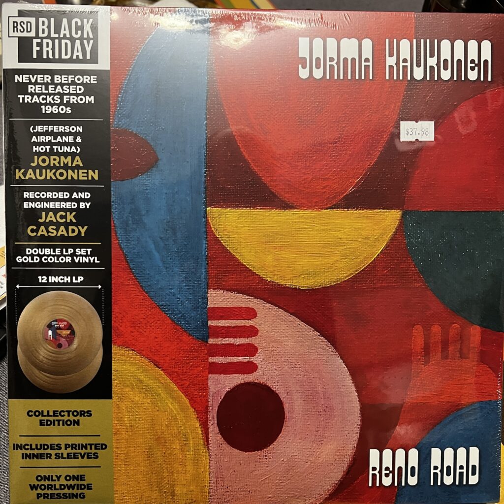 Cover of Jorma Kaukonen's album Reno Road, with an abstract painting of different colored semi-circles, ovals, semi-ovals. 