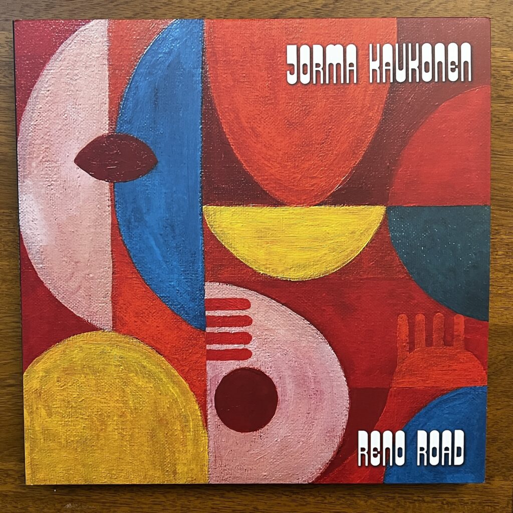 Front cover of Reno Road, with the title and artist name superimposed over a piece of abstract art.