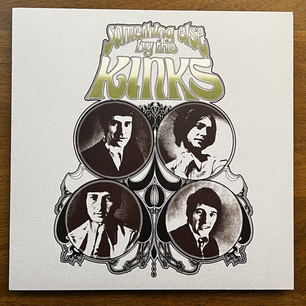 Something Else by the Kinks front cover – the type is in a drawn, fantasy-style font above four circular photographs, in high-contrast black and white, of the four members of the band. The circles are linked by art nouveau decorative elements.