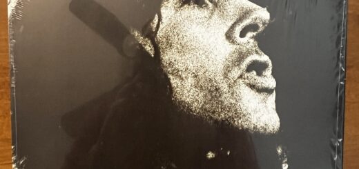 A Banquet In Blues front cover – with a dark, mezzotinted photograph of John Mayall's face in profile.